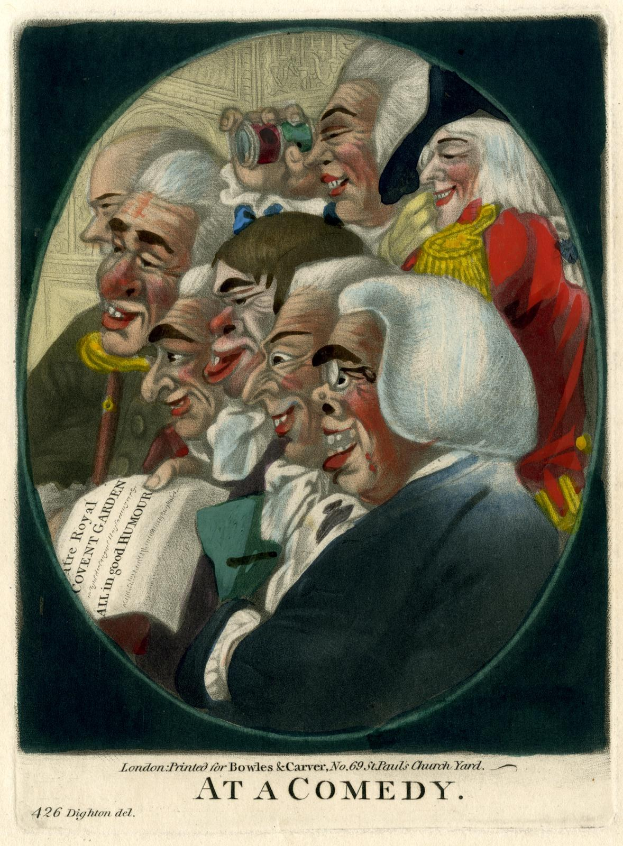 Eine Gruppe von Menschen, die in einem Kreis stehen, einer hält ein Papier in der Hand und lacht, während sie eine komödiantische Darbietung genießen.