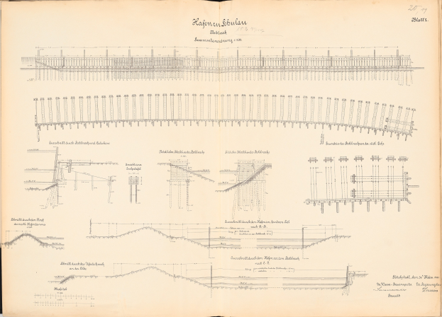 Offenes Buch mit detaillierten Zeichnungen und Text, enthält eine Illustration einer Bahnschiene und bietet einen Überblick über ein Eisenbahnsystem.