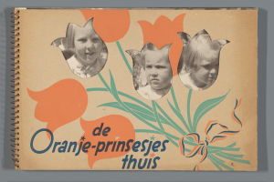 Ein Buch mit einem Cover, das drei strahlende Kinder verschiedenen Alters und Geschlechts zeigt, das auf einer flachen Oberfläche liegt und Text lesbar ist.